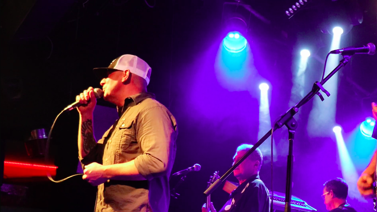 Sold For Sheep singer with full band on stage